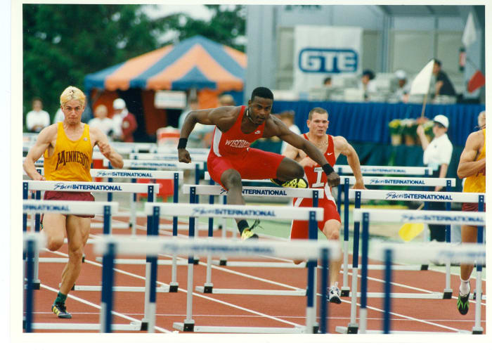 Hurdler Reggie Torian running while with the Wisconsin Badgers.